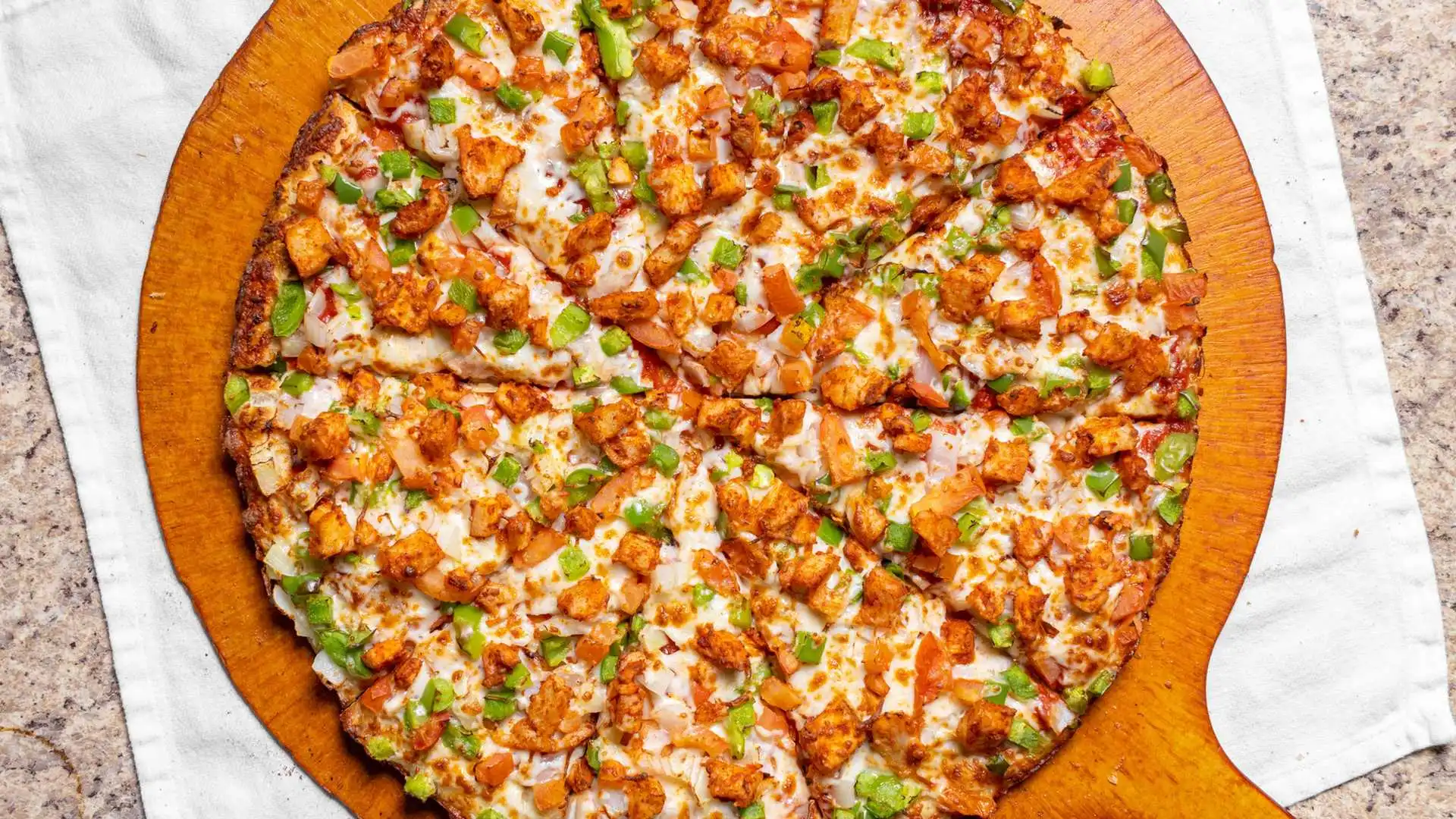 Delicious Tandoori Chicken Pizza at Pizza64 Beaumont Alberta